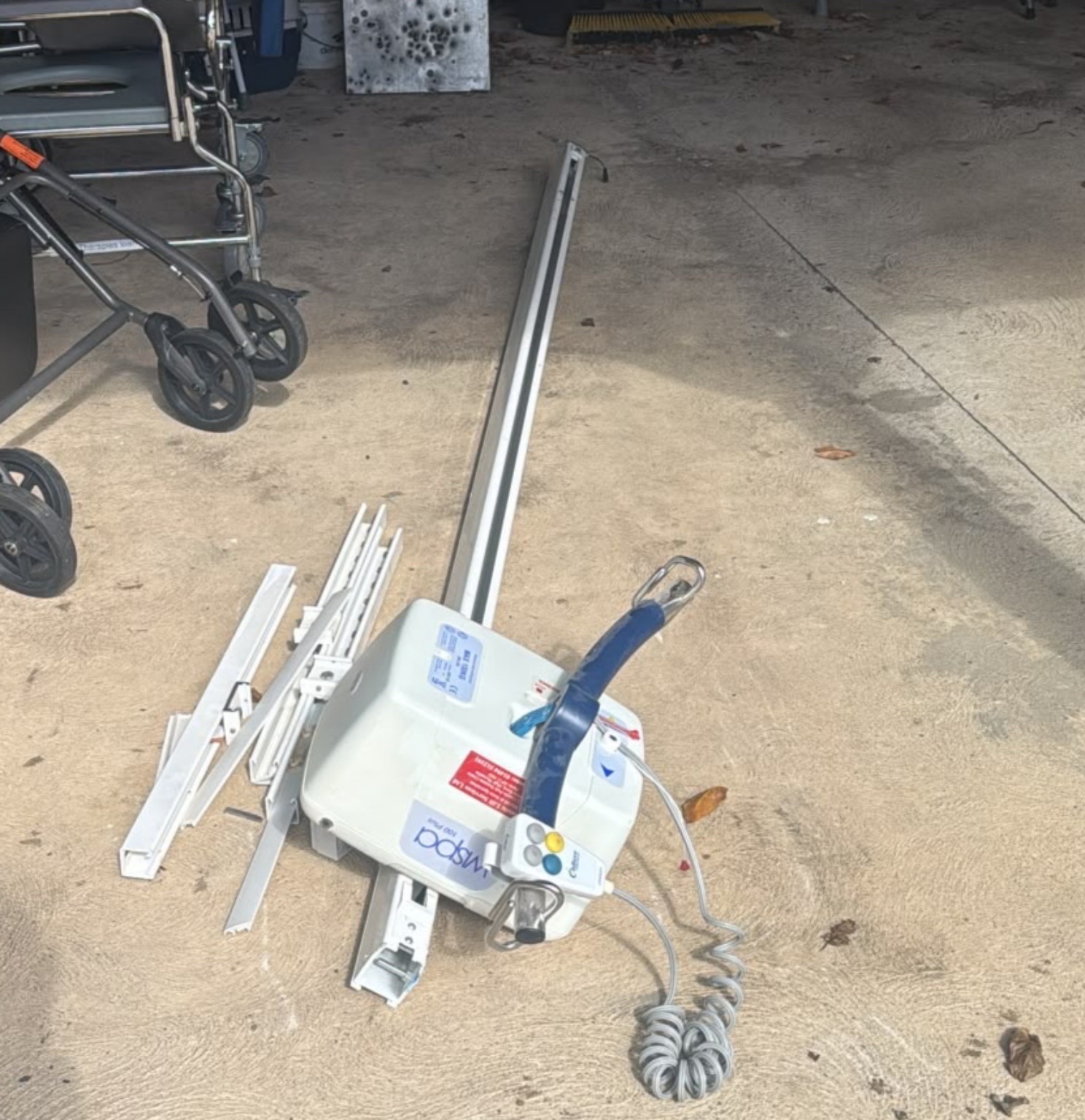 Donated ceiling hoist unit and rail collected by ReStart Mobility