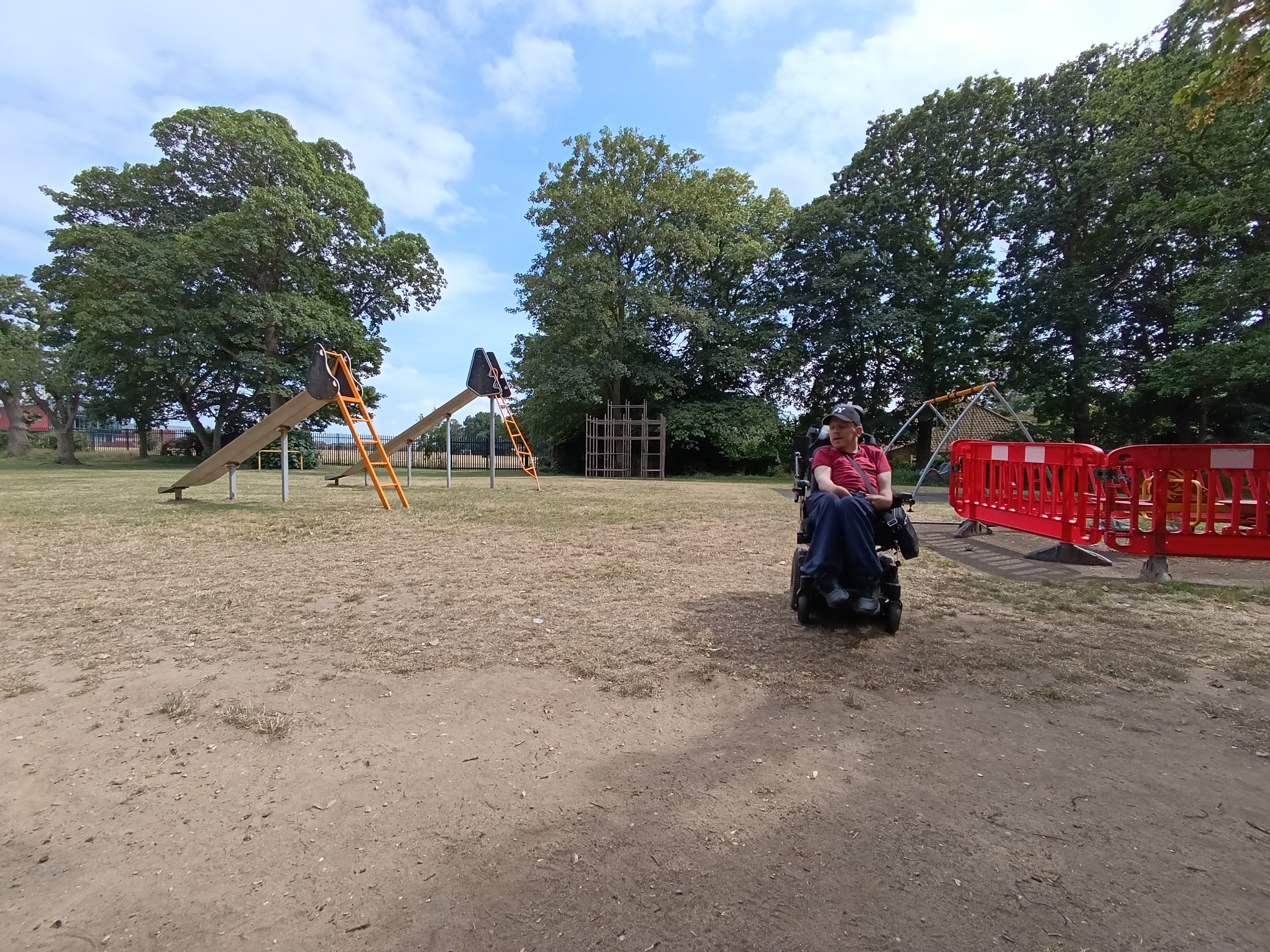Luke Walker using his powered wheelchair outdoors